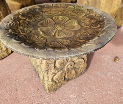small bird bath with flowers