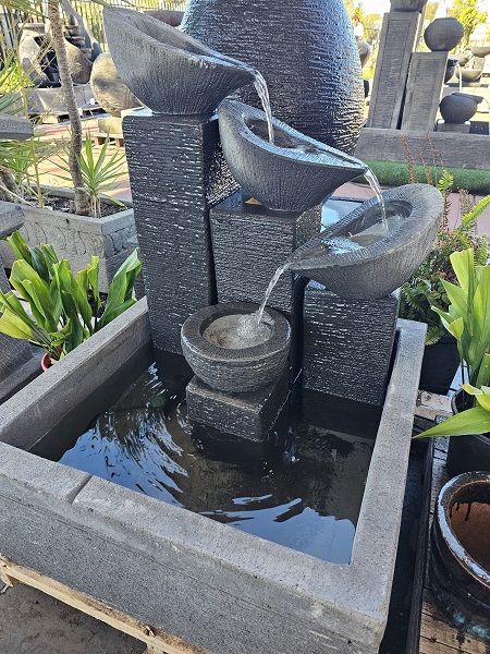 Flowing bowls in square base water feature