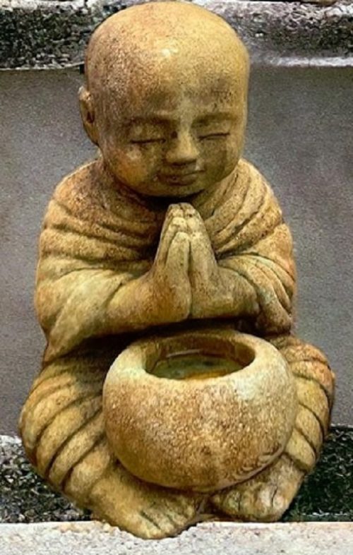 Monk holding bowl
