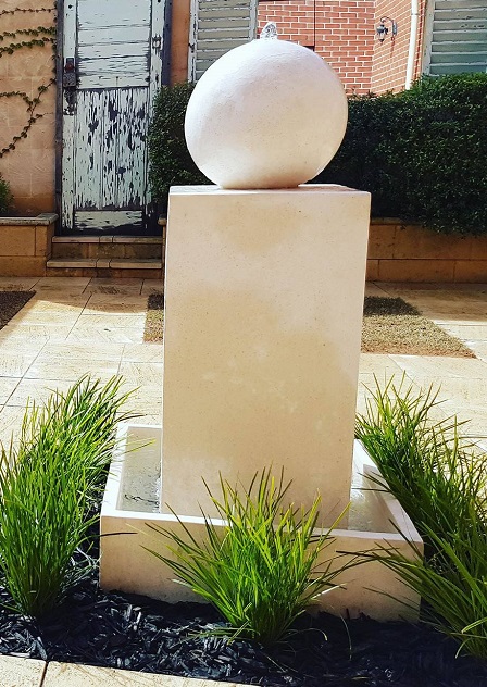 White ball on column water feature