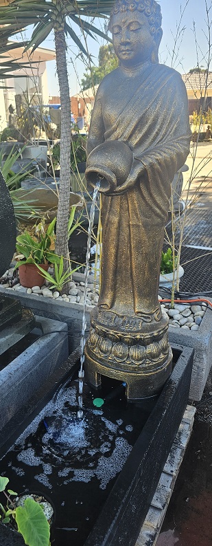 standing Buddha with jug